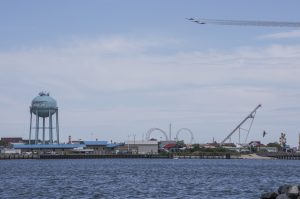 overview of ocean city inlet with blue angels flying through the sky