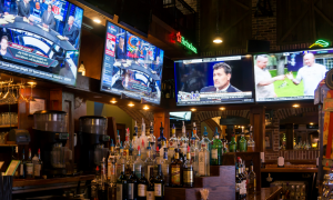 sports bar with tv's and liquor shelf