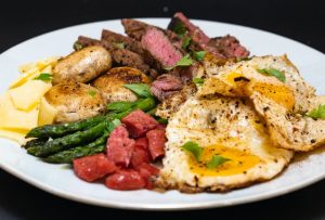Plate with steak, eggs, and vegetables