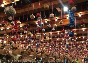Christmas balls hanging from the ceiling at Nick's