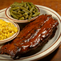 Plate of ribs, corn and green beans