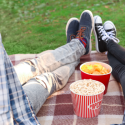 Young Couple Watching Movie in Outdoor Cinema